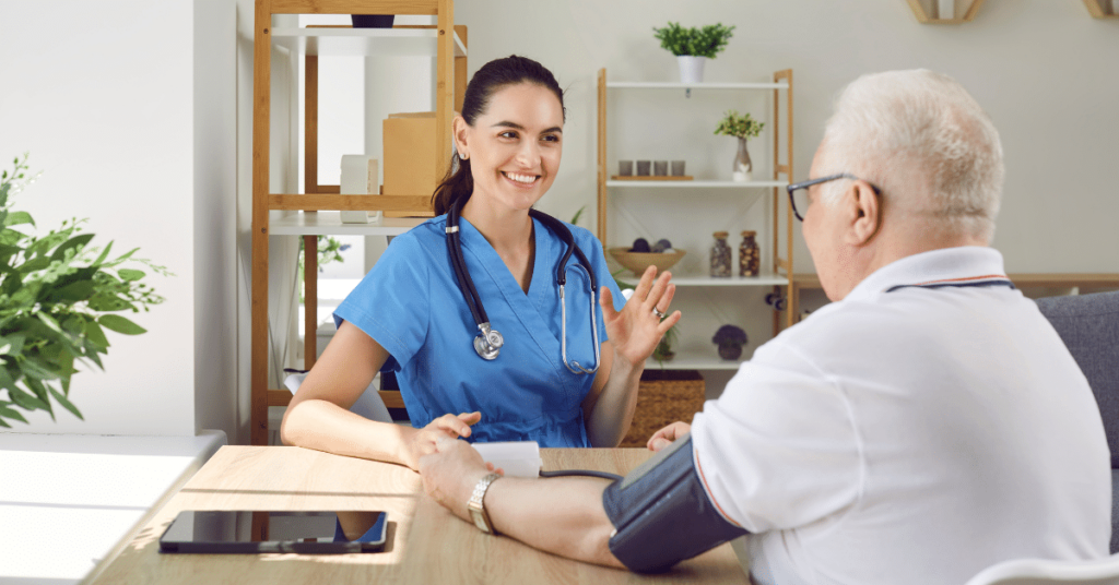 A vascular nurse carefully measuring the arterial blood pressure of an elderly patient with hypertension, highlighting the vital role and significance of vascular nurses.