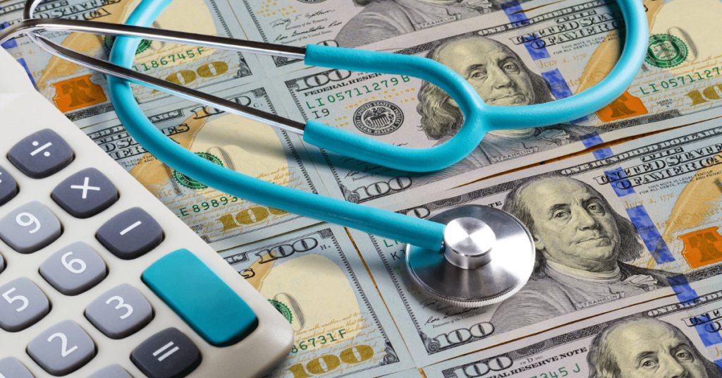 Banknotes with stethoscope and calculator representing fluctuation in travel nurse rates.